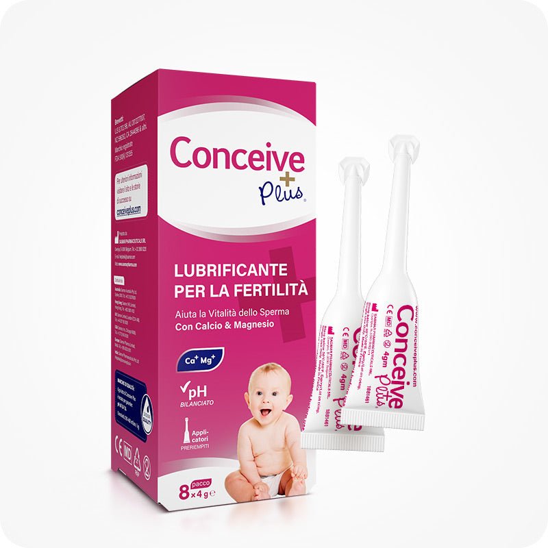 Conceive Plus Fertility Lubricant Applicators (IT) 8-pack box with two pre-filled 4g applicators shown beside packaging on a white background. Italian box design features pink and white branding, text highlighting pH bilanciato and calcium & magnesium ion support for sperm vitality. Includes baby image and icons indicating pre-filled applicators and multi-use benefits.