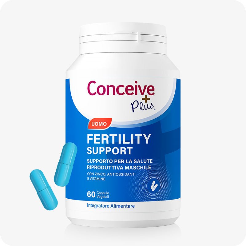 Conceive Plus Men's Fertility Support (IT) bottle featuring a blue and white label with 60 vegetarian capsules, shown front-facing with two blue capsules beside it, designed to support male reproductive health.